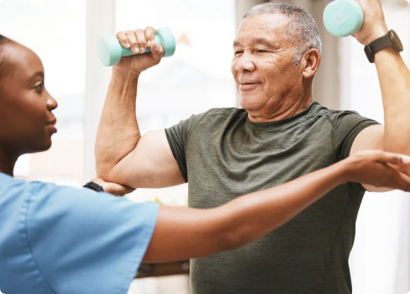health professional helping person lift weights